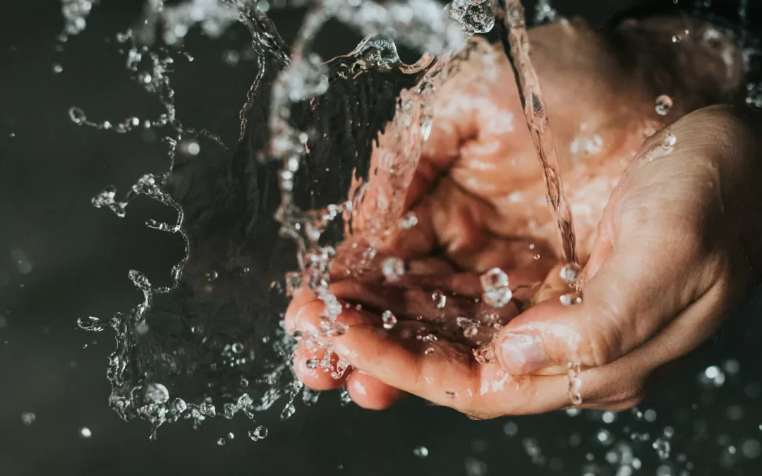 Picture of water falling into hands